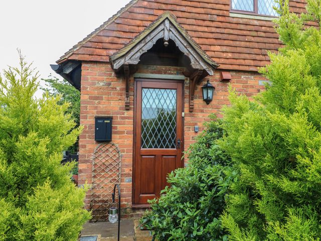 A front entrance with a door and mailbox at Barclay Cottage in Biddenden