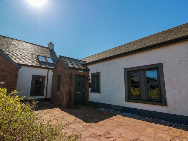 An exterior view of a house with a pathway at Ballaganlea in Alexandria