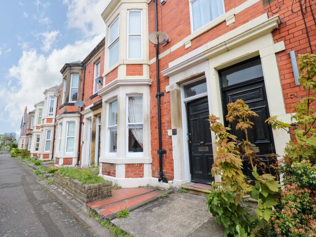 A row of houses with red brick exteriors at 17 Fairfield Road