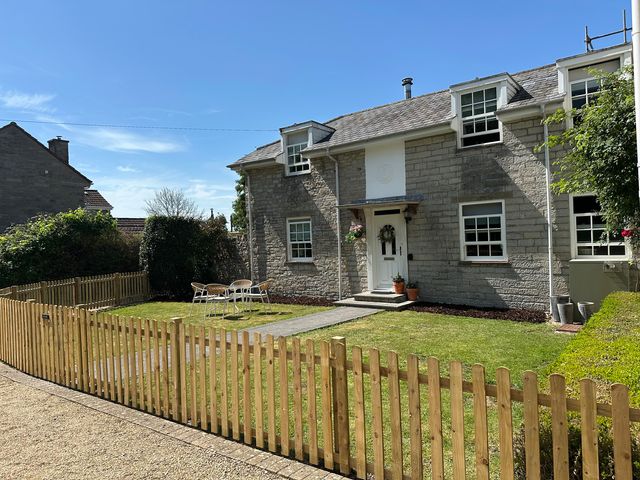 A house with a garden and pathway at The Little Vicarage in Mark
