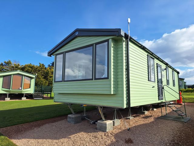A mobile home with steps at St Andrews Holiday Park - Taigh na Mara in St Andrews