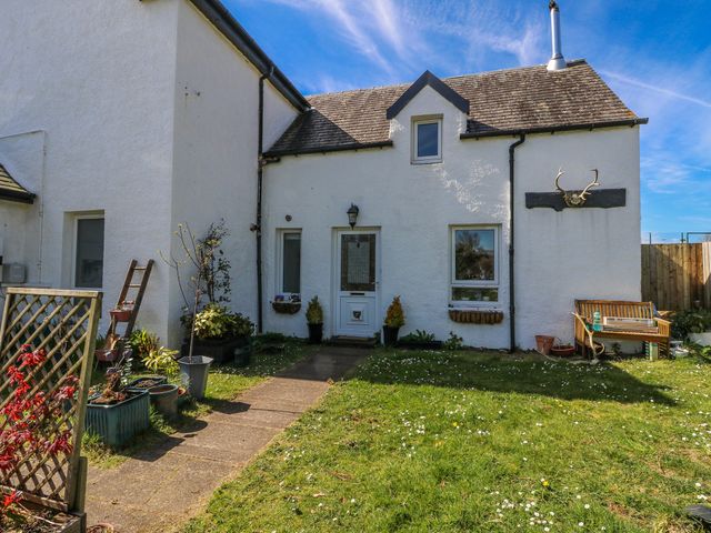 A house with a pathway and plants at Schoolhouse in Oban