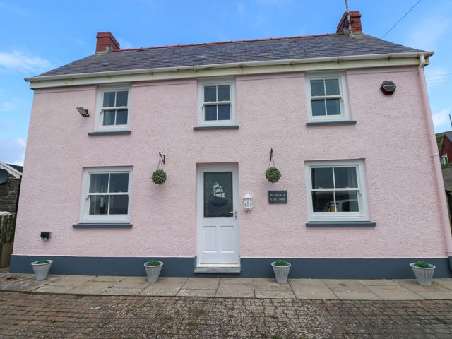 A house exterior with a front door and windows at Newgale Cottage in Haverfordwest