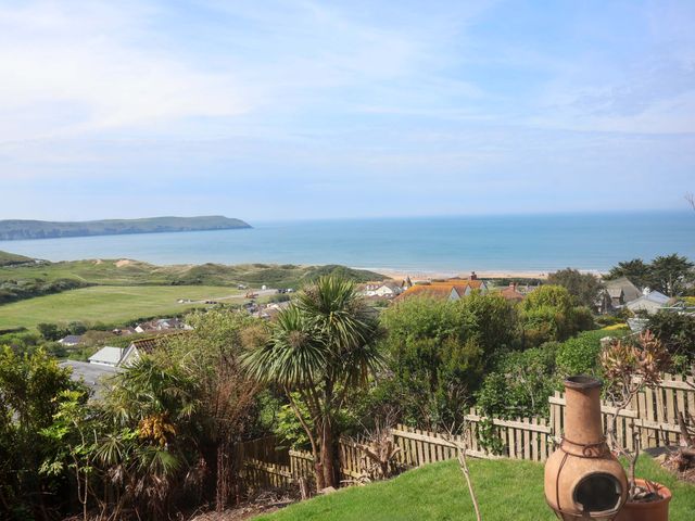 A coastal view with sea and hills at 15 Chichester Park