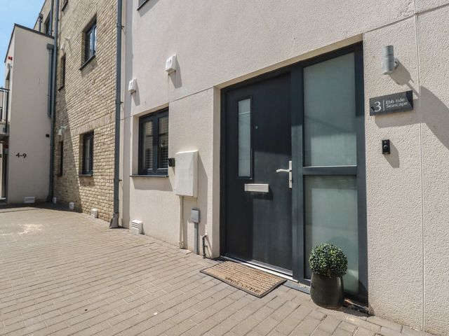 An entrance with a door and welcome mat at Ebb Tide Seascape in Newquay