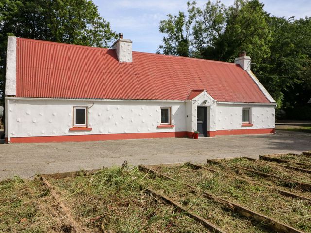 A house with a red roof and garden area at Gullane East, Rathmore, County Kerry