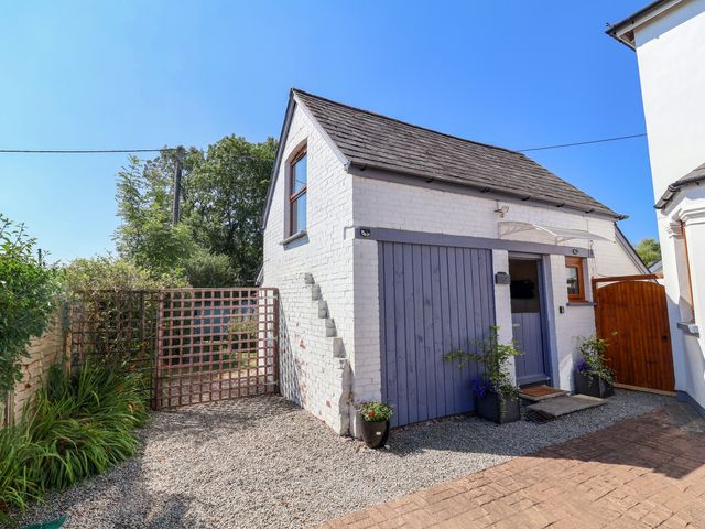 A house exterior with a gate and pathway at Coach House Highampton near Black Torrington