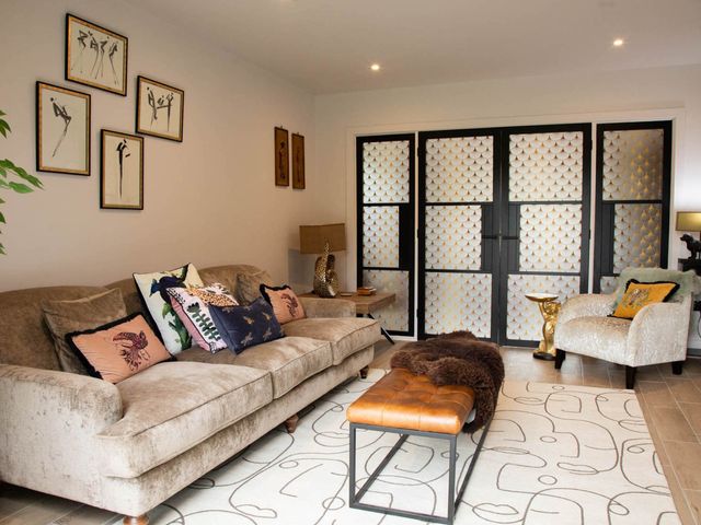 A living room with artwork on the wall at House Sleeps 10 with Enclosed Garden Checkendon near Henley-On-Thames