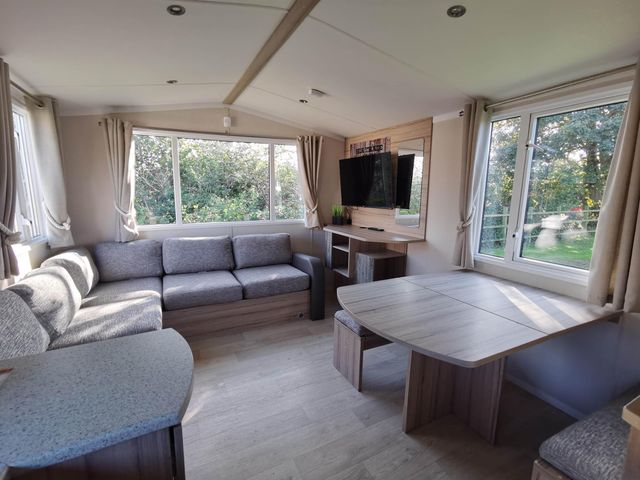 A living room with a sofa and television at 8Berth- SmartTV- CloseToBeach- FamilyFriendly in Mablethorpe