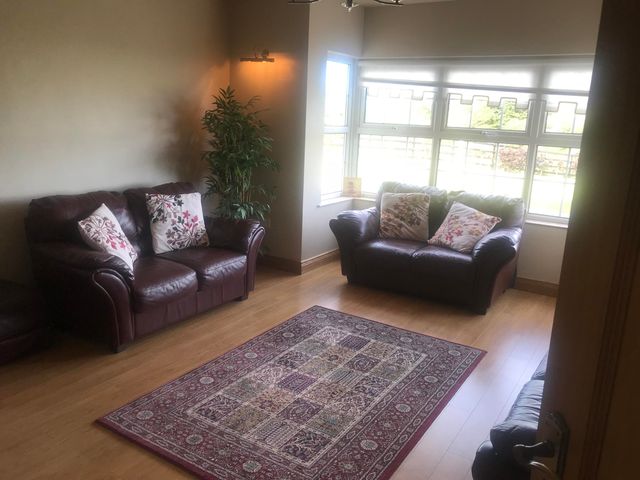 A living room with two sofas and a rug at Dungannon 2 Bed Bungalow - Sleeps 5 - Pet Friendly near Dungannon