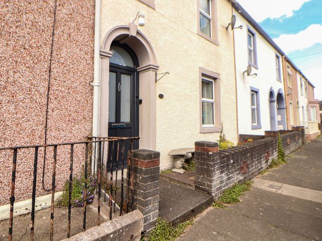 A front entrance with door and railings at 30 George Street Wigton