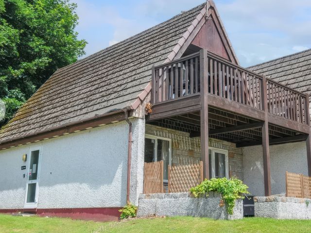 A house with a balcony and garden at 9 Honicombe Park in Callington