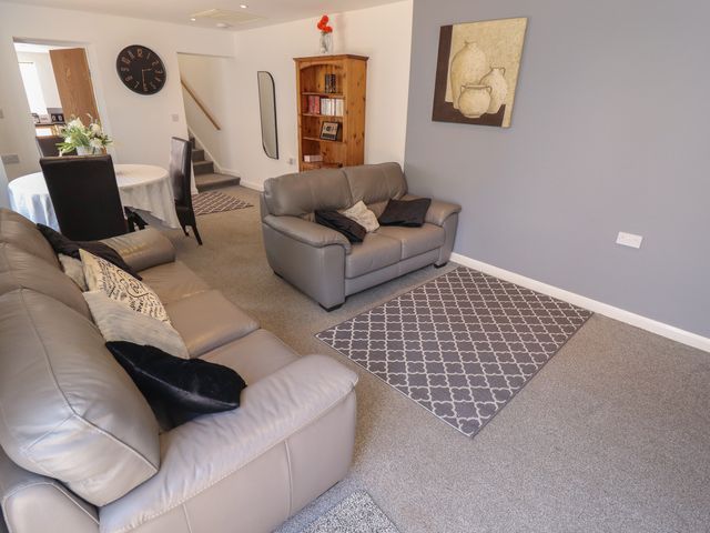 A living room with a sofa and bookshelf at Number 3 Old Boston Road, Coningsby