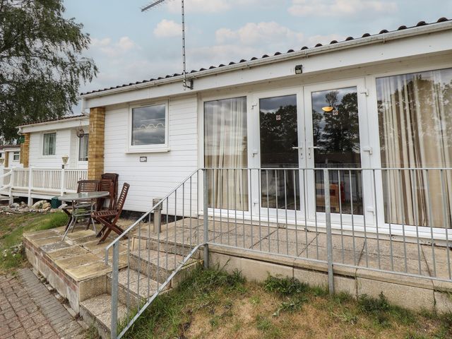 An outdoor area with a table and chairs at Cosy Home in Great Yarmouth