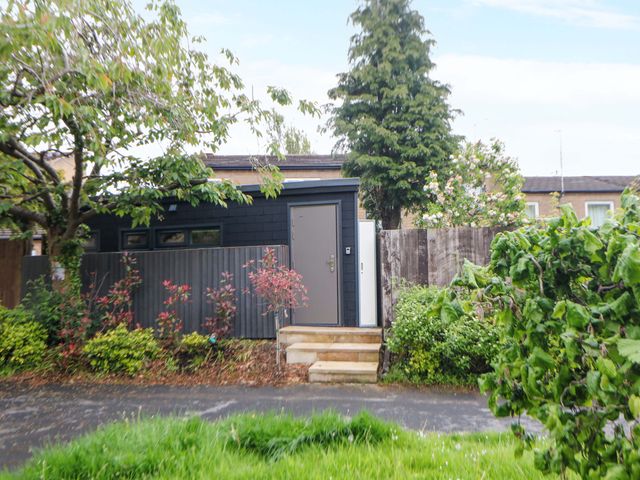 A house with a door and trees at Dore Cabin in Sheffield