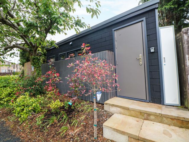 A building with a door and steps at Dore Cabin Sheffield