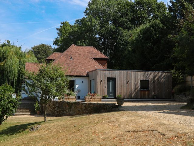 A house with a lawn and trees at Cree Cottage