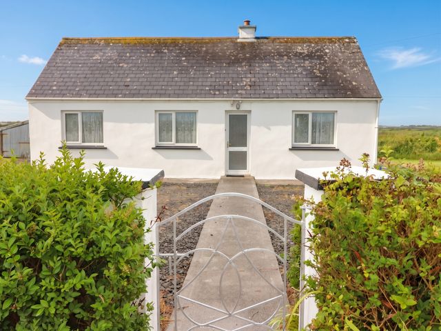 A house with a pathway leading to the entrance at Golf Club View, County Clare