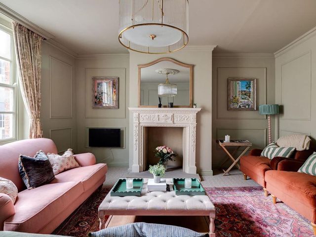 A living room with a fireplace and sofas at Luxury Georgian Townhouse / sleeps 10 / parking