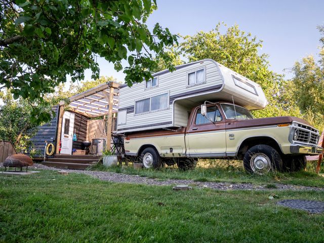 A truck with a camper mounted on it at 1 Bed Vehicle Luxury Camper -Hot Tub, Pets - Willy, Mill Lane Farmhouse near Burgh Le Marsh