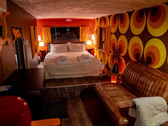 A bedroom with a bed and a couch at Sleeps 2 -Pets Welcome -Private Hot Tub -Alabama 