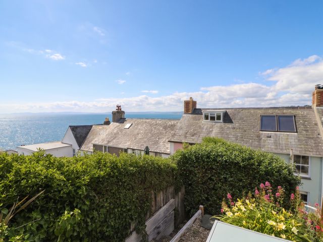 An outdoor view of rooftops and ocean at Arosfa in New Quay