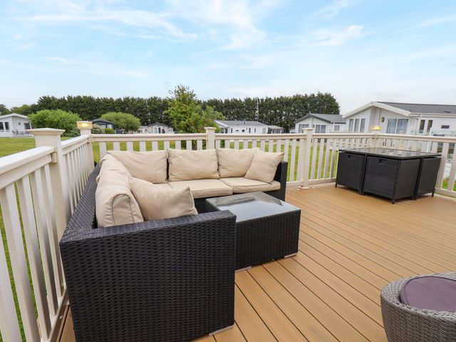 An outdoor seating area with a sofa and table at Finch 66 in Scarborough