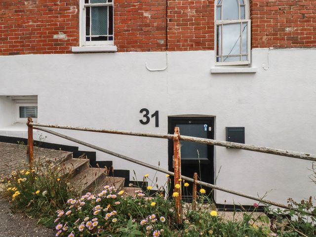 A building with a door and flowers at 31 Tregoney Hill Mevagissey
