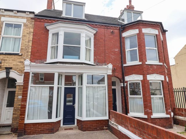 A house exterior with multiple windows and a front door at 154 Queen Street in Withernsea