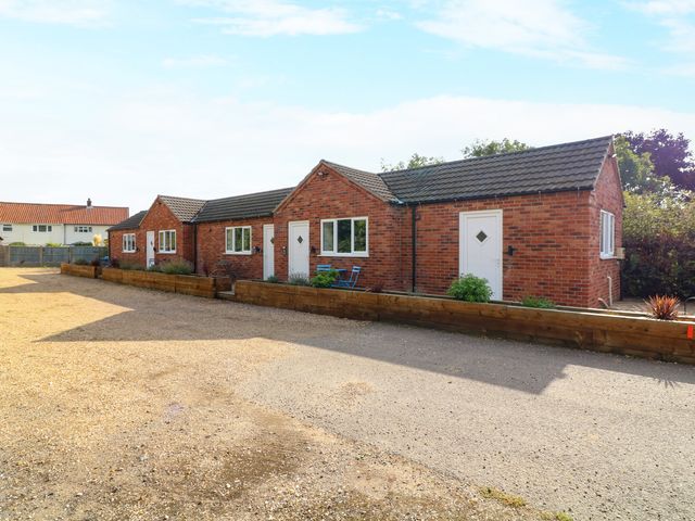 A row of cabins with doors and windows at Walcott Lodges - Tupholme near Billinghay, Lincolnshire