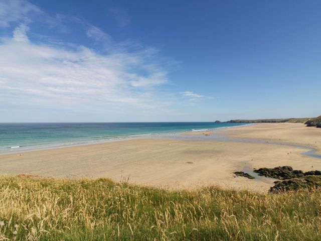 A beach with sand and water at Roslenn in St Agnes