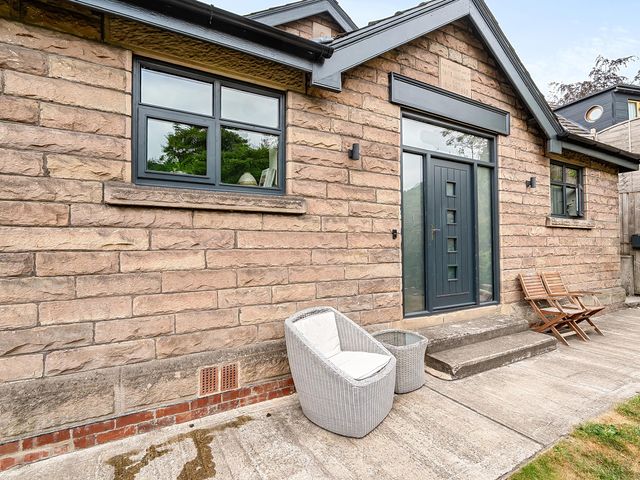An outdoor area with stone house and seating at Stunning Retreat in the Heart of Matlock Bath, Matlock Bath near Matlock