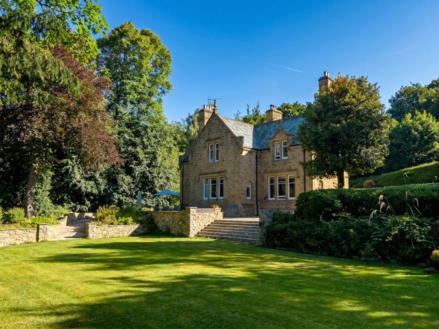 A house with garden and trees at Chowdene Lodge Estate
