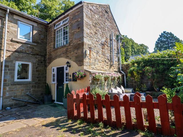 An outdoor view of a house with a garden at Arch Mews Cottage Middleton-In-Teesdale
