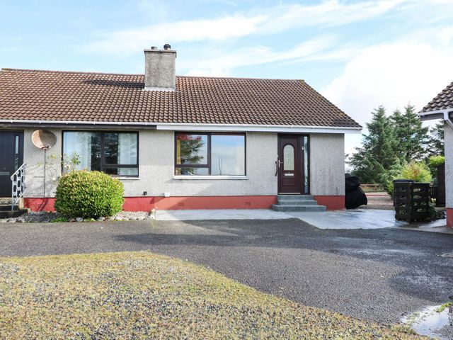 A house with a front door and garden at 7 Creag Ruadh in Laxdale near Stornoway