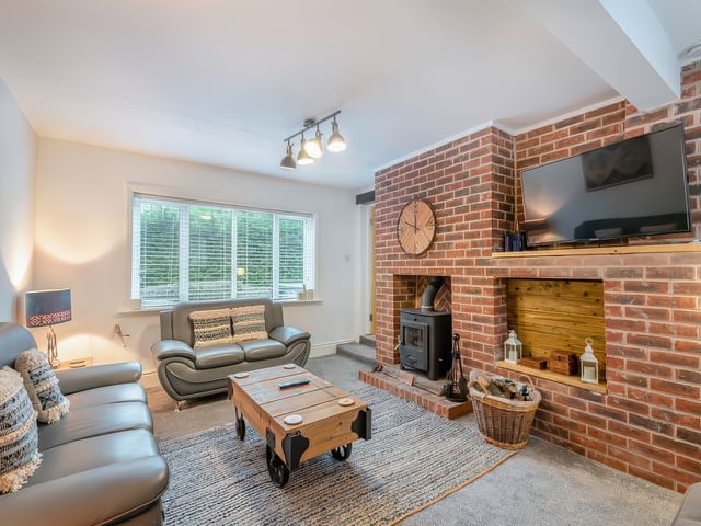 A living room with a sofa and coffee table at an unspecified property