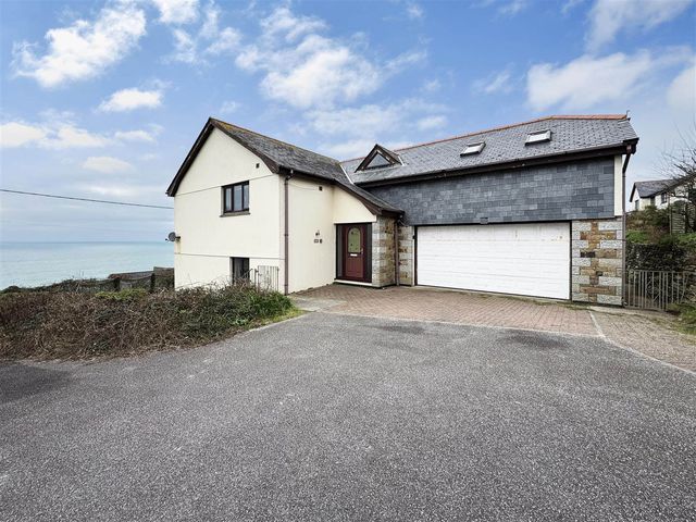 A house with a garage and driveway at Porthleven Coastal Retreat with 5 Bedrooms Porthleven