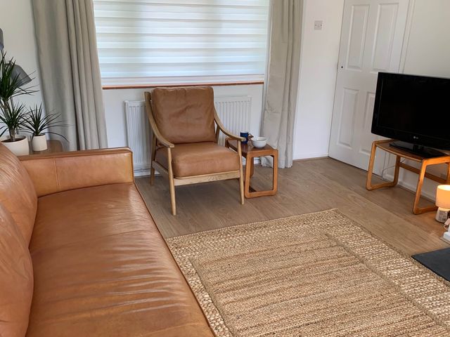 A living room with a sofa and armchair at 2 Bed Sleeps 4 Parking Pets 10 min walk to Beach Falmouth
