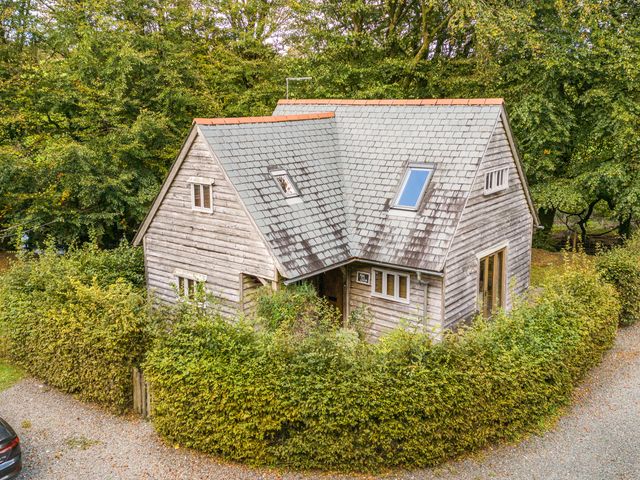 A house surrounded by greenery at Cabin Sleeps 6 with Parking and Patio in Tremail near Camelford