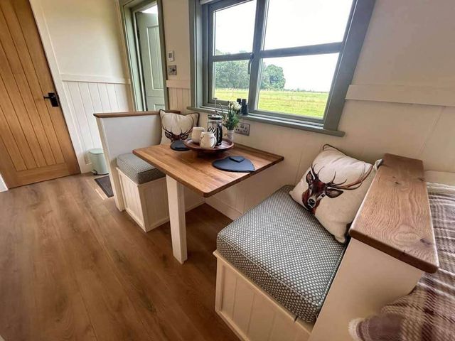 A dining area with a table and seating at an unknown location near Bishop's Waltham