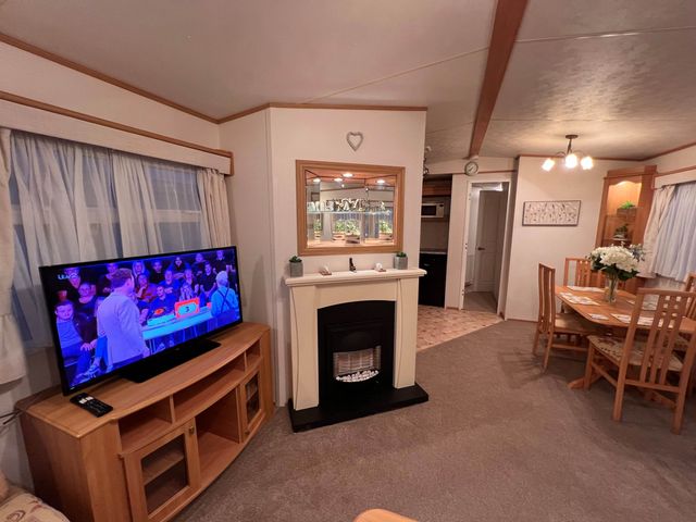 A living room with a television and fireplace at 