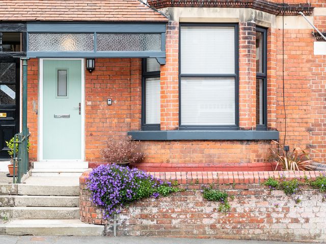 A door with a window and flowers at 38 Ashville Avenue Scarborough