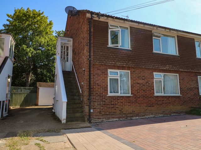 A building with a staircase and driveway at Sussex Close New Malden