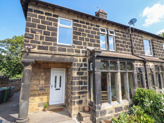 A house with a front door and windows at Burras Hill in Otley