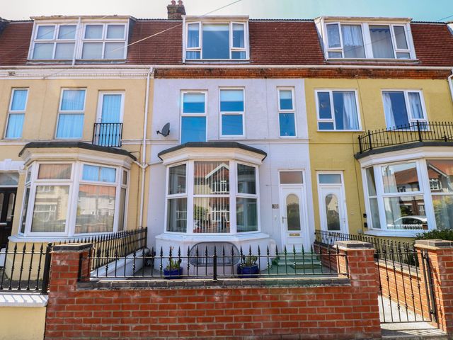 A row of houses with windows and doors at 33 North Denes in Great Yarmouth