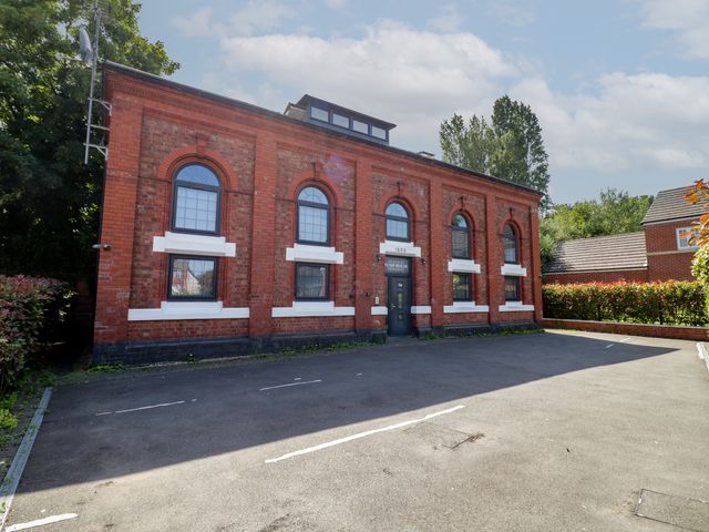 A building with windows and a door in an outdoor area at 4 Pump House Birmingham