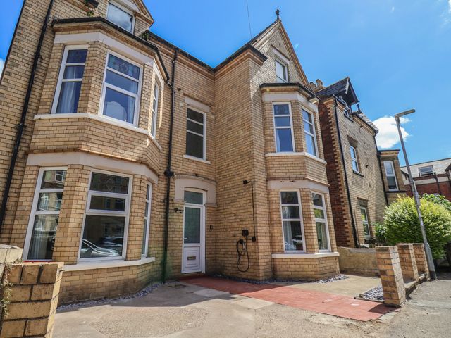 An exterior view of a building with windows and a door at Lansdowne Grange in Bridlington