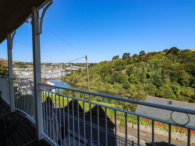 A view from a balcony overlooking a river and trees at 2 Inglewood Apartments in Dartmouth