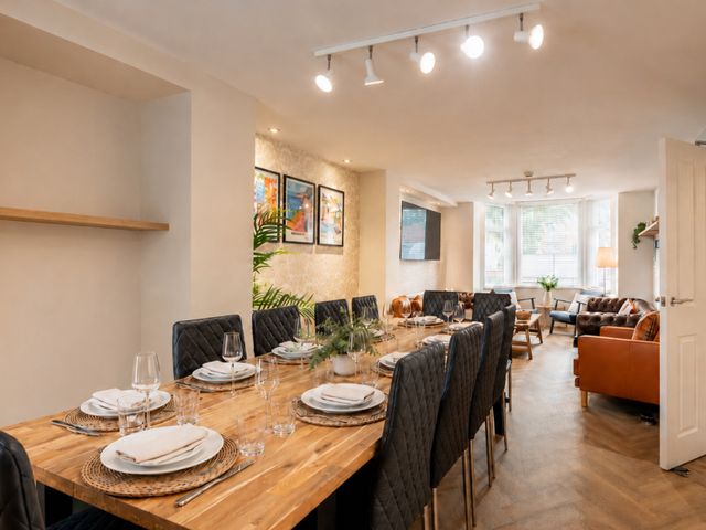 A dining room with a large table and eight chairs at 125 Columbus Ravine, Scarborough