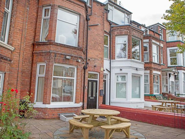 An outdoor area with a table and benches at 127 Columbus Ravine Scarborough